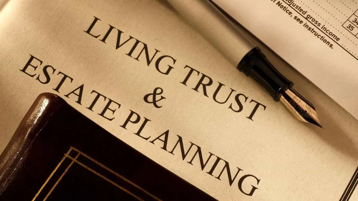 Close-up of a Living Trust and Estate Planning document with a fountain pen resting on it